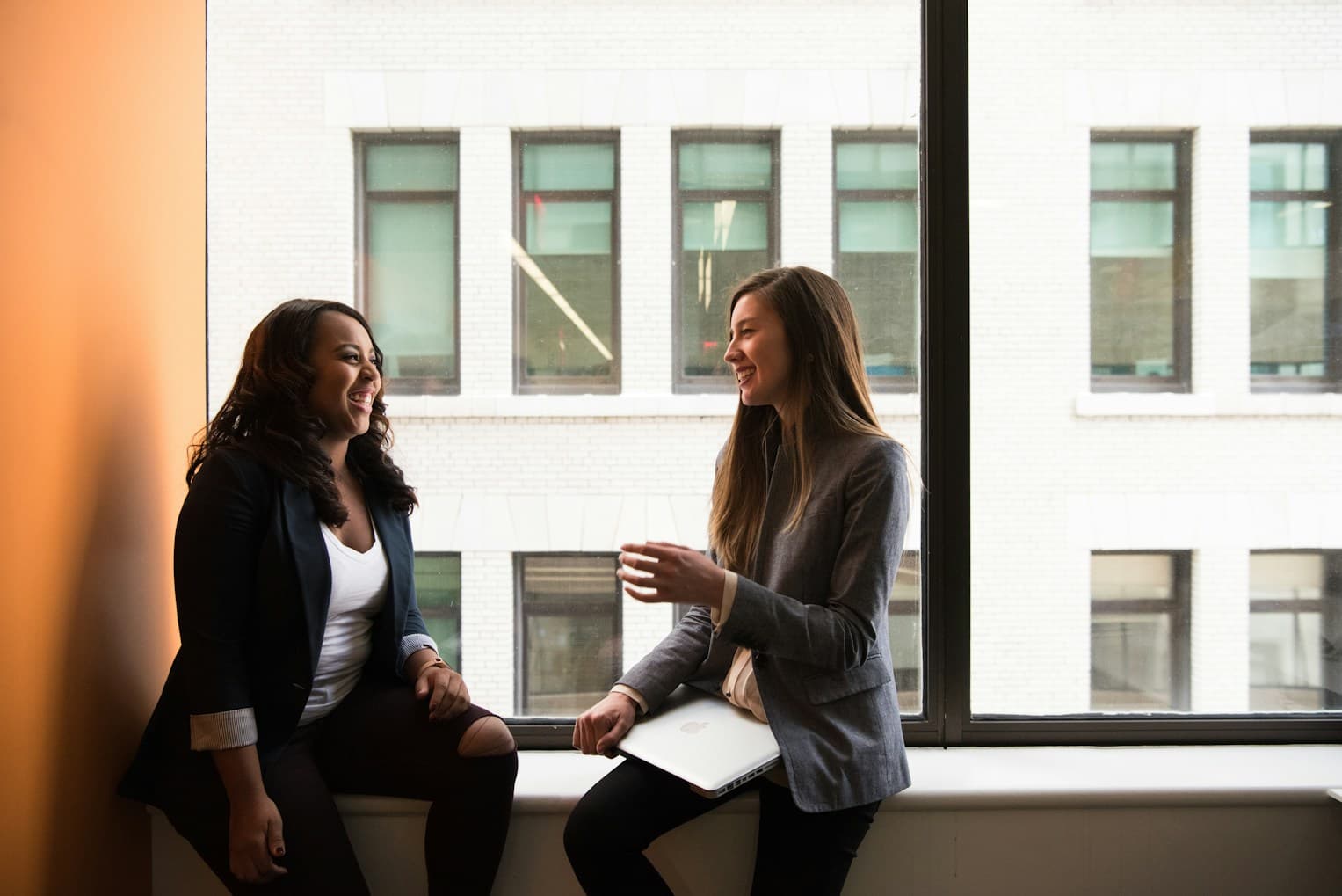 Two people talking face to face in a relaxed setting